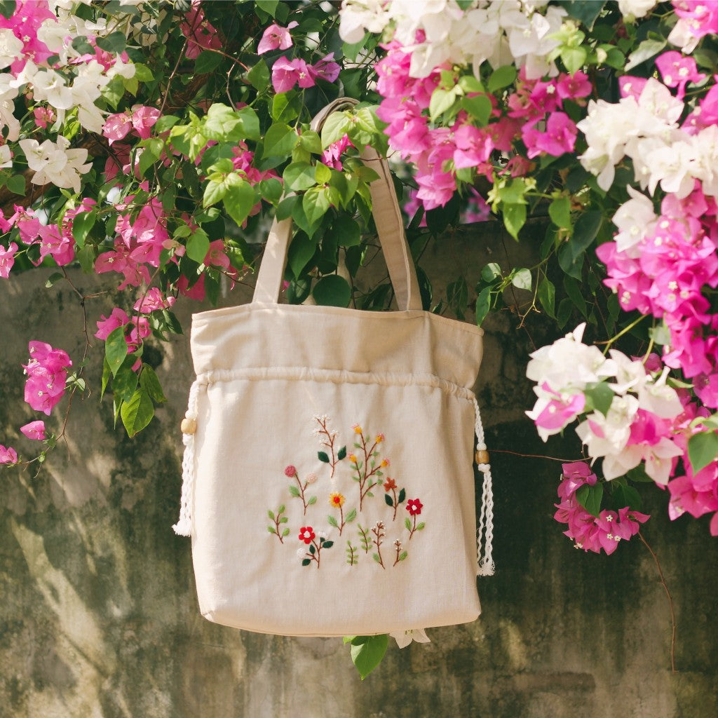 Hand-embroidered cream beige powder linen drawstring tote bag