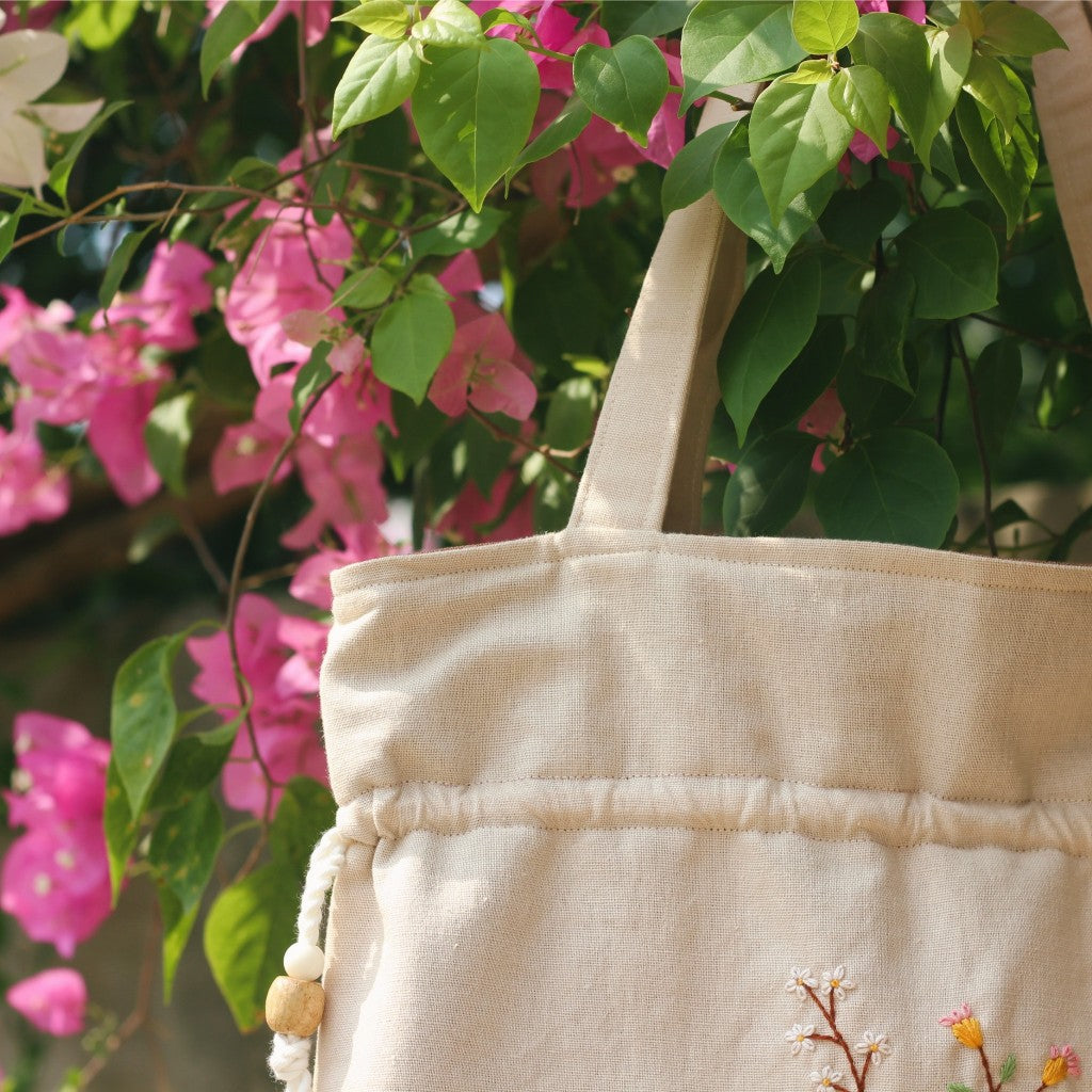 Hand-embroidered cream beige powder linen drawstring tote bag