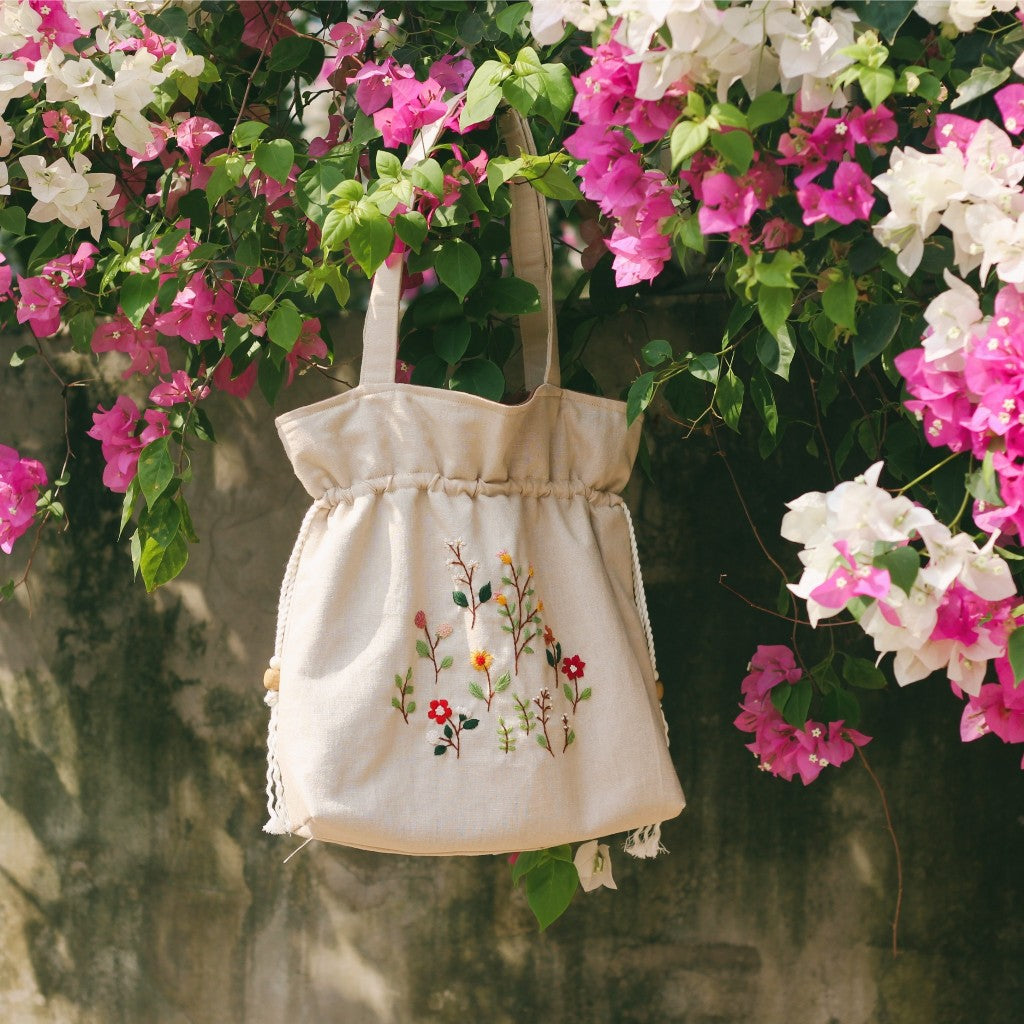 Hand-embroidered cream beige powder linen drawstring tote bag