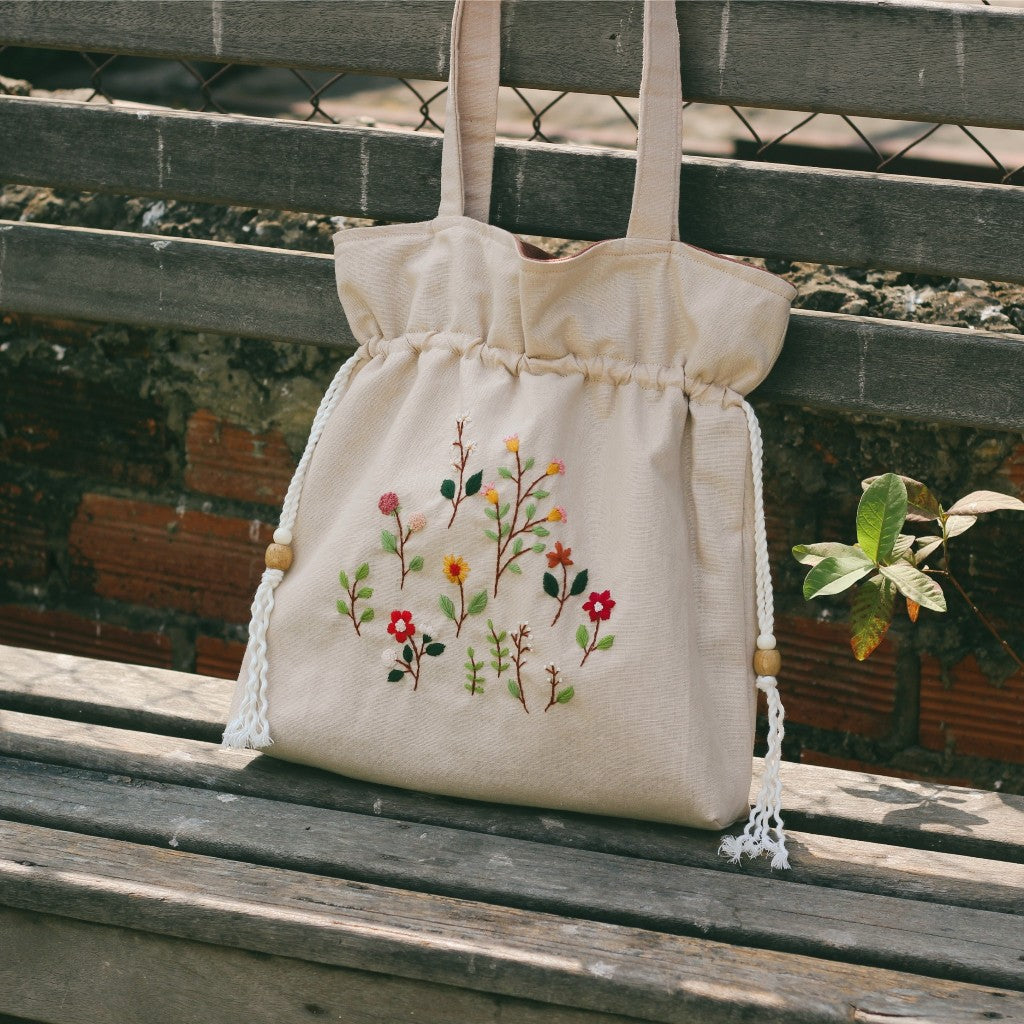 Hand-embroidered cream beige powder linen drawstring tote bag