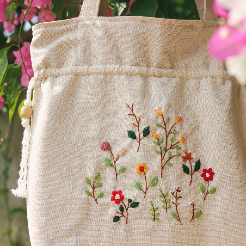 Hand-embroidered cream beige powder linen drawstring tote bag