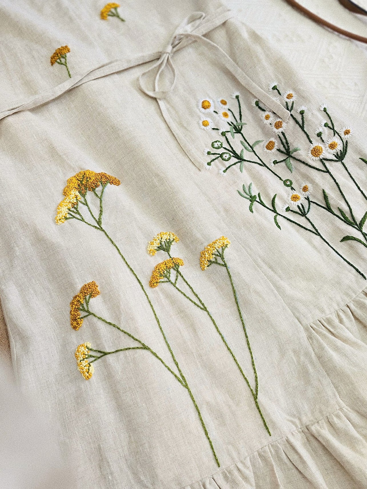 The dandelion flower hand- embroidered linen dress