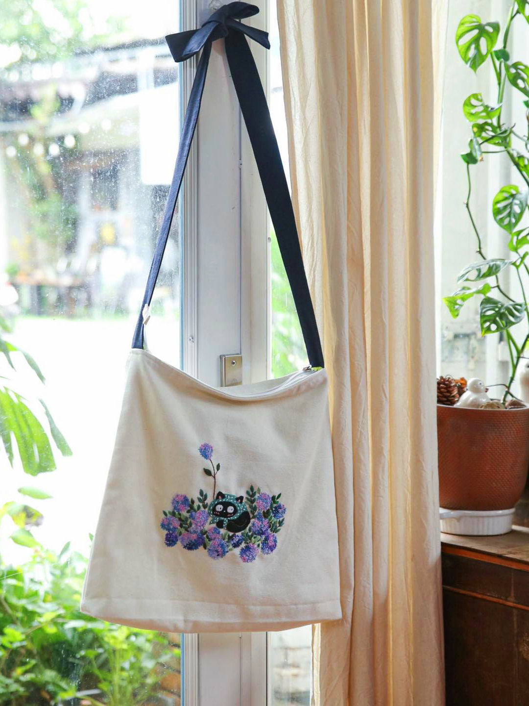 Hand-embroidered canvas tote handbag