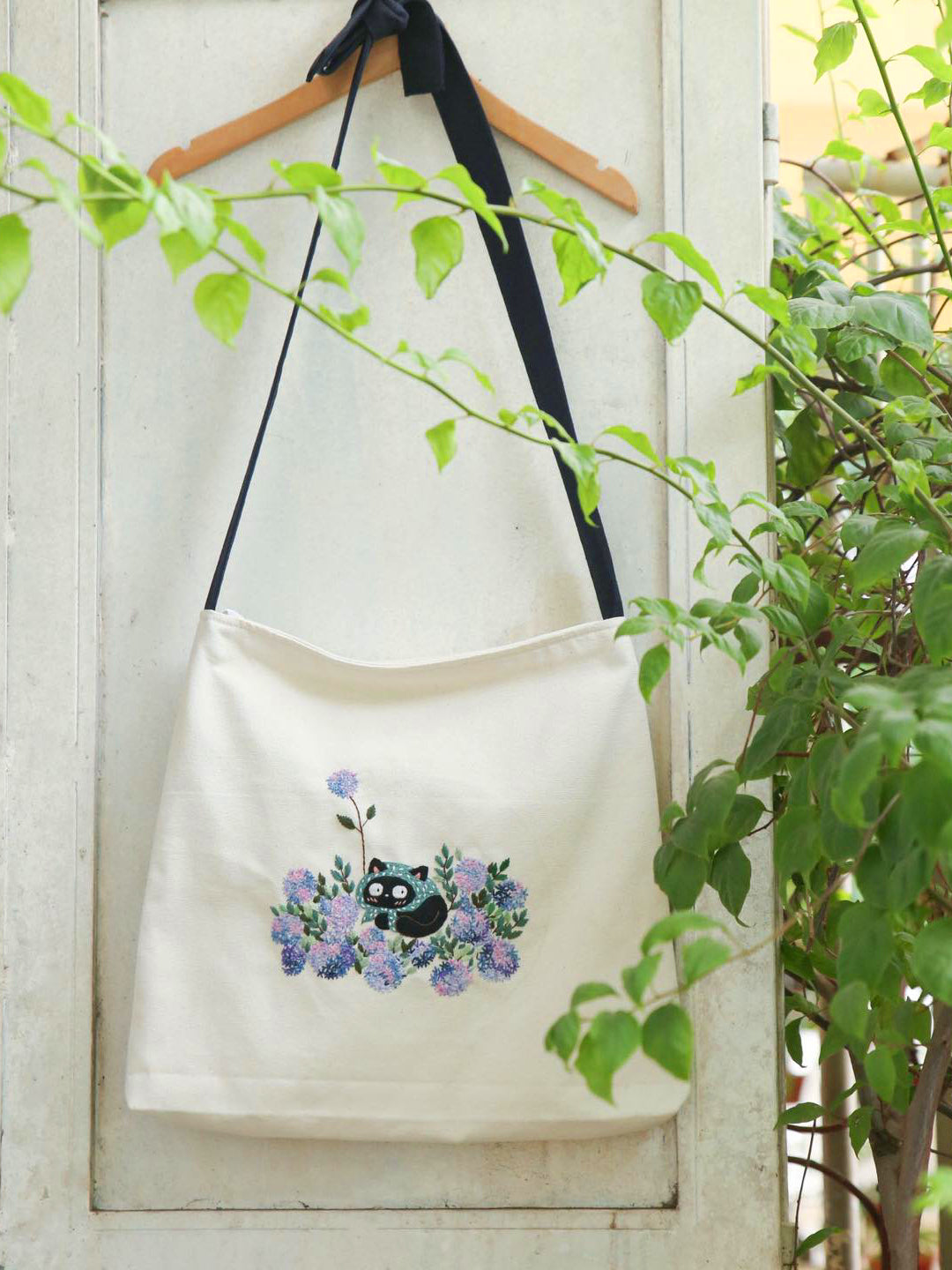 Hand-embroidered canvas tote handbag